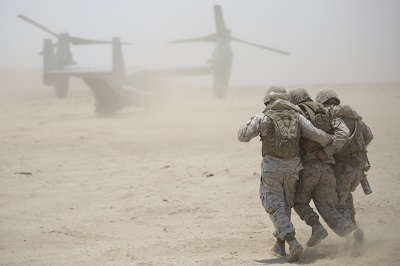 Marines and Sailors participate in a mass heat casualty exercise in support of ITX 4-15