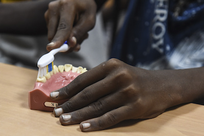 CJTF-HOA Civil Affairs team teaches local children oral hygiene, preventative care