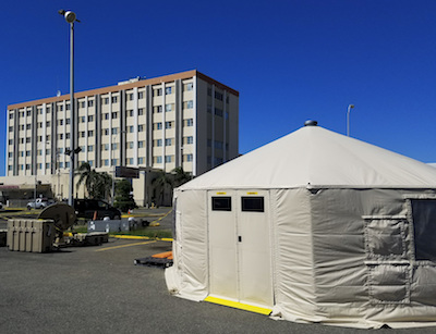 Medical Tent Sits in Front of Hospital