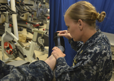 Physical Therapy Officer Administers Treatment