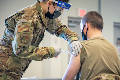 Massachusetts military forces join together to administer vaccine