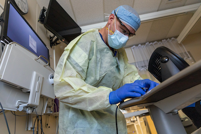 Member of the U.S. Army Medical Response Team Does Routine Hospital Work