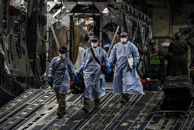 Mobility Airmen conduct historic first aeromedical evacuation mission using Transport Isolation System